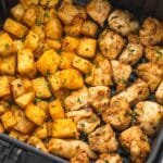Chicken and potatoes are roasted in the air fryer