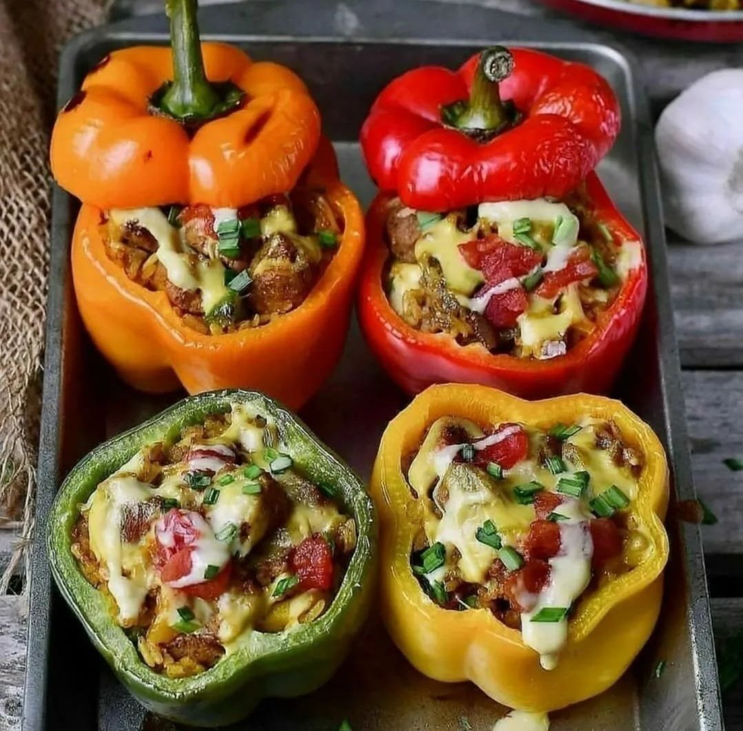 Presenting a delectable treat that is visually appealing and tastes great: Stuffed Cheesy Bell Peppers! This recipe elevates the simple bell pepper to new levels by packing it full of flavourful ingredients and binding them all together with luscious, melted cheese.